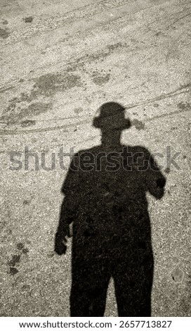 man's shadow under the light 