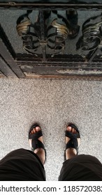 Man's Slippers Waiting In Front Of Door