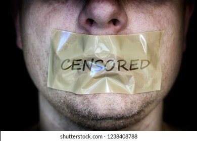 A Man's Taped Mouth As A Sign Of Censorship