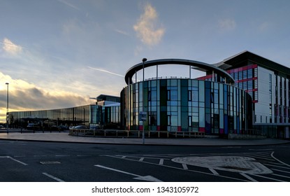 MANSFIELD, UK - MARCH 16, 2019:  Exterior Of The Steel & Glass Front Of Kings Mill Hospital In Dark Twilight, Refurbished & Remodeled In 1960s Style Under Tony Blair's Government