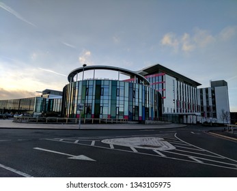 MANSFIELD, UK - MARCH 16, 2019:  Exterior Of The Steel & Glass Front Of Kings Mill Hospital In Dark Twilight, Refurbished & Remodeled In 1960s Style Under Tony Blair's Government