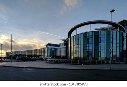 MANSFIELD, UK - MARCH 16, 2019:  Exterior Of The Steel & Glass Front Of Kings Mill Hospital In Dark Twilight, Refurbished & Remodeled In 1960s Style Under Tony Blair's Government