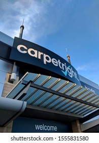 MANSFIELD, UK - NOVEMBER 10, ‎2019: Sign, exterior and awning of Carpetright carpet and bed store against a bright blue autumn sky, at St Peters Retail Park