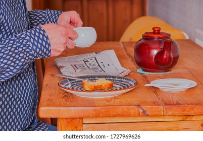 Mansfield,Nottinghamshire,Great Britain,5/2/2020 12:20 Pm,person Sat Down Holding Cup Of Tea In There Hand, While Reading Newspaper.