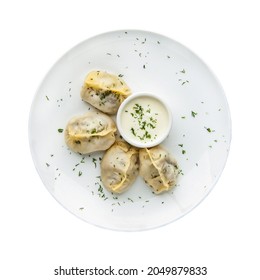 Manti in a plate on a white background.  Top view. Isolated - Shutterstock ID 2049879833