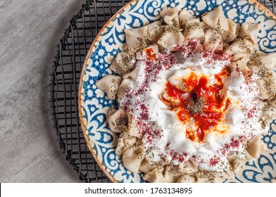 Manti Turkish Ravioli Kayseri with yogurt and chili sauce 