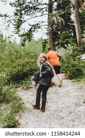 Manti, UT / United States - June 7, 2018: Young Little Sister And Brother Exploring In The Woods