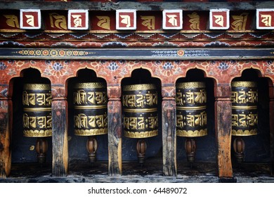 Mantra Written On Prayer Wheels In Bhutan.