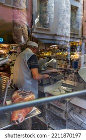 Mantua, Italy - 20-08-2022: A Typical Shop Of Italian Gastronomic Specialties With Cold Cuts And Cheese In A Window Of A Typical Street Of Mantua In Lombardy.