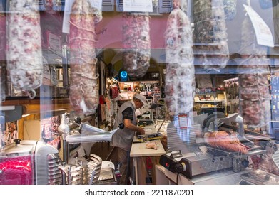 Mantua, Italy - 20-08-2022: A Typical Shop Of Italian Gastronomic Specialties With Cold Cuts And Cheese In A Window Of A Typical Street Of Mantua In Lombardy.