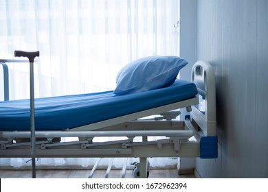 Manual adjustable hospital bed in hospital room. Clean manual adjustable bed is for patient admitted to hospital for medication and rehabilitation. Health care insurance & adjustable hospital bed. 
