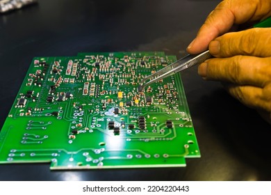 Manual Assembly Of Electronic Components And Microcircuits On Printing Circuit Board With Printed Multi Wire Connections. Electronics Manufacturing Services. High Quality Photo