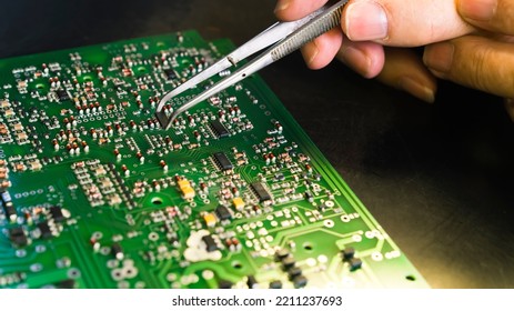 Manual Assembly Of Electronic Components And Microcircuits On Printing Circuit Board With Printed Multi Wire Connections. Electronics Manufacturing Services. High Quality Photo