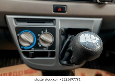 Manual car gears, the driver must first step on the clutch pedal before shifting gears. When the process of shifting gears can not be arbitrary so that the transmission system is not easily damaged. - Shutterstock ID 2225697791