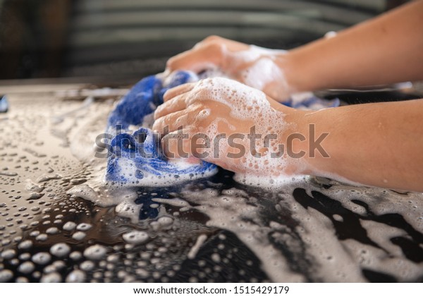 Manual car wash with
blue car wash cloth