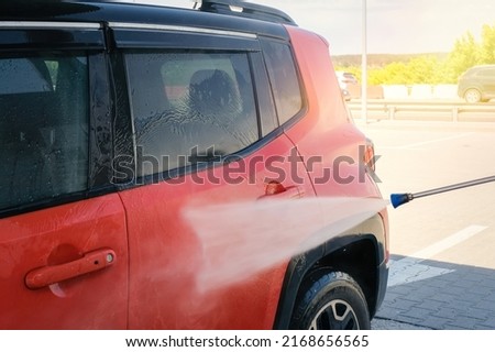 Manual car wash. Car wash with high pressure water