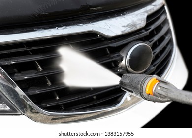 Manual car wash with pressure water outside. Car Washing. Cleaning car using high pressure water. Car detailing. Hand washer. Soft lighting - Shutterstock ID 1383157955