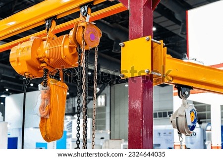 Manual chain hoist and overhead electric chain hoist install at mono rail runway beam