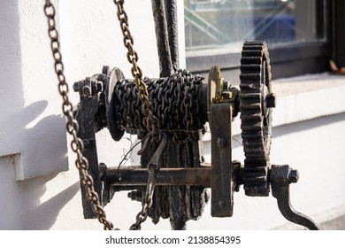 Manual Chain Winch Mounted On The Building Wall