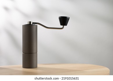 Manual coffee grinder on table