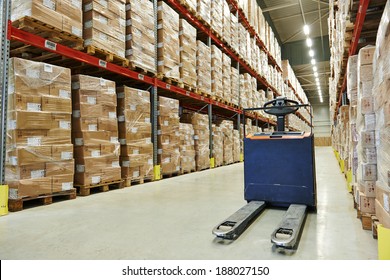 Manual forklift pallet stacker truck equipment at food warehouse