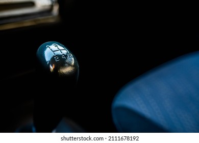 Manual gear shift knob close up shot on an old japanese 4 wd car, shallow depth of field, space for text.