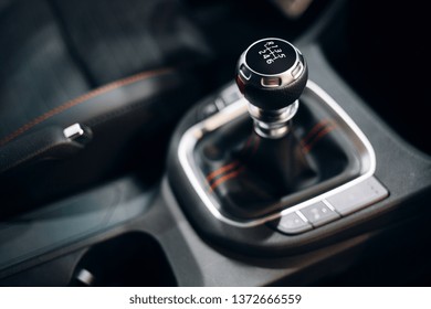 Manual gearbox handle inside the modern car. Gear shift stick close up. 6 manual gearbox shifter