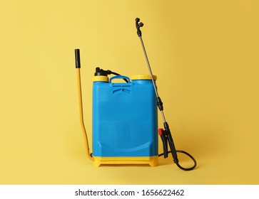 Manual Insecticide Sprayer On Yellow Background. Pest Control