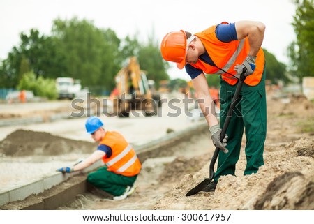 Manual labourer working on the city street