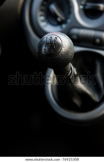 A manual shift car gear\
lever