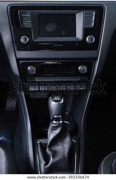 A manual shift of\
modern car gear shifter