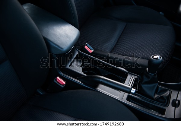 Manual transmission shift select stick.\
Mechanical gear shift, driver\'s seat inside\
car