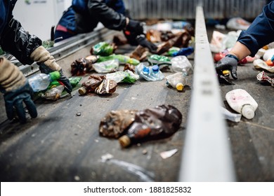 Manual waste bulkhead. Waste sorting plant conveyors filled with various household waste. Modern waste processing. - Shutterstock ID 1881825832