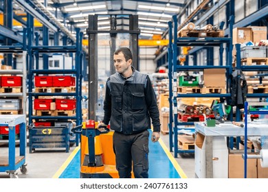 Manual worker carrying a handcart in a warehouse of a logistic center - Powered by Shutterstock