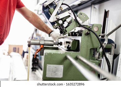 Manual Worker Cutting Aluminum And PVC Profiles. Manufacturing Jobs. Selective Focus. Factory For Aluminum And PVC Windows And Doors Production.