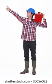 A manual worker pointing at something.