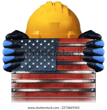Manual worker with protective work gloves and orange hardhat holding a metal national flag of the United States of America, USA (American flag), isolated on white background.