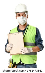 Manual worker wearing protective face mask and gloves to avoid Coronavirus epidemic holds clipboard isolated on white background. 