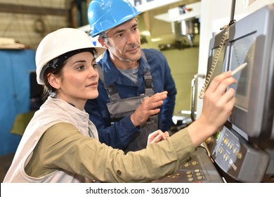 Manufacture workers working on electronic machine