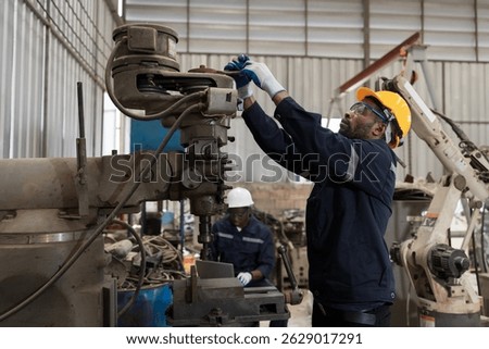Manufacturing industry, machine and engineer setup, maintain, repair mechanism of operation of drilling milling machine in machinery warehouse
