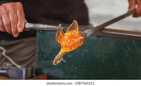 Manufacturing process and modeling of a glass figure, Murano, Venice, Veneto, Italy - Powered by Shutterstock