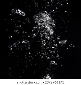 Many air bubbles in water on black background - Powered by Shutterstock