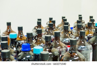 The Many Of Amber Glass Bottle Contains Chemical Hazardous Waste From The Laboratory, Selective Focus