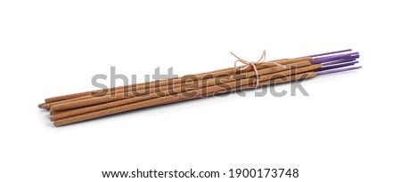 Many aromatic incense sticks tied with twine on white background