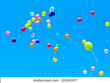 Many balloons fly into the blue sky - Powered by Shutterstock - Get 15% off with code: PIKWIZARD15