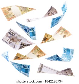 many banknotes from brazil falling on white background, two hundred, one hundred and fifty reais in free fall - Shutterstock ID 1842128734