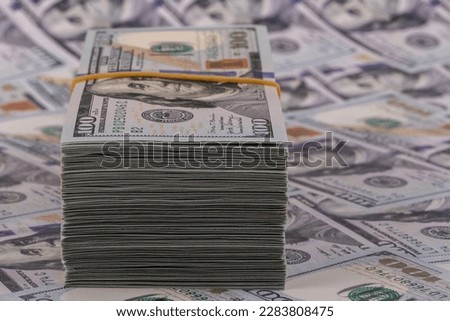Many banknotes in denominations of 100 American dollars