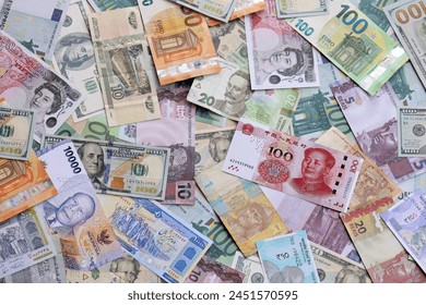 Many banknotes of different currency. Background of big amount of random money bills close up - Powered by Shutterstock