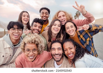 Many Beautiful People Standing In A Circle Smile At The Camera Taking A Portrait Outdoors - Large Group Of Multiracial Friends Taking A Selfie - Happy Young Students Taking A Photo Outside School