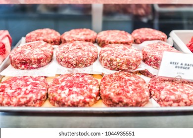 Many Beef And Bacon Burger Raw Meat Sausage Patties On Tray With Pink Chunks In Butcher Store Shop